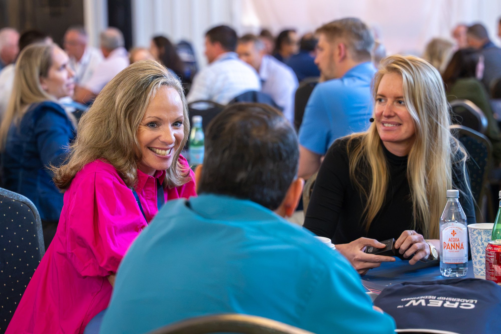 Bridget Hilton at a workshop table with participants